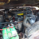 The SJ Cherokee’s carbureted AMC V8.